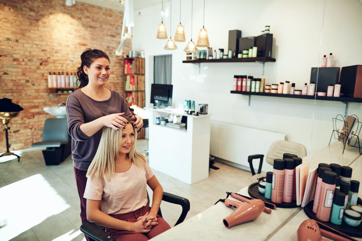 Woman talking with hair stylist